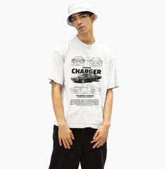Person wearing a white t-shirt with 'Dodge Charger' graphic design on a white background