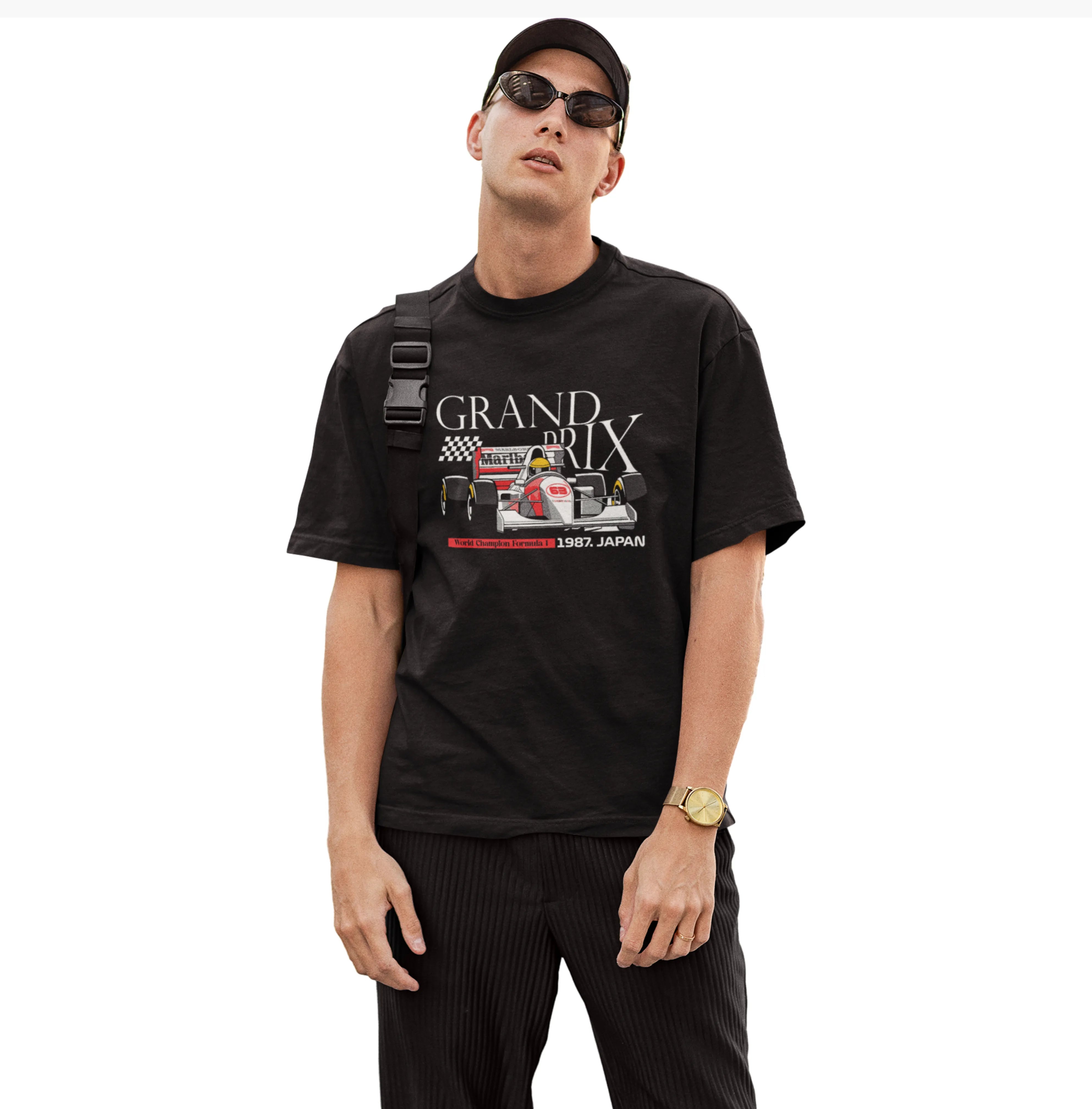 Man wearing a black t-shirt with 'Grand Prix' graphic design on a white background