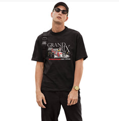 Man wearing a black t-shirt with 'Grand Prix' graphic design on a white background