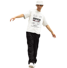 Person wearing a white t-shirt with Porsche logo and black pants on a white background