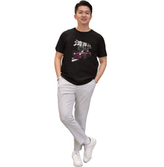 Person wearing a black t-shirt with a graphic design on a white background