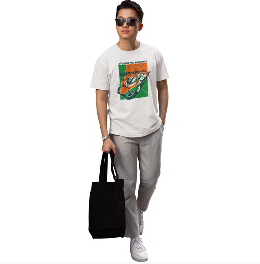 Person wearing a graphic t-shirt, holding a black tote bag on a white background