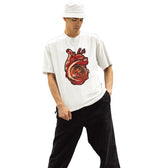 Person wearing a white t-shirt with a red graphic design on a white background
