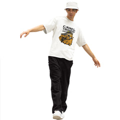Person wearing a white t-shirt with a graphic design and text, black pants, and a white cap on a white background