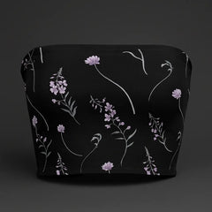 Black top with floral pattern on a dark background