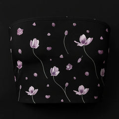 Black pouch with pink floral pattern on a black background