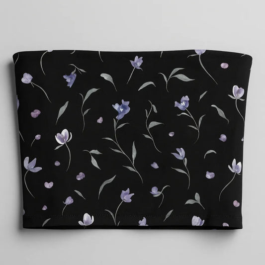 Black tube top with floral pattern on a light gray background