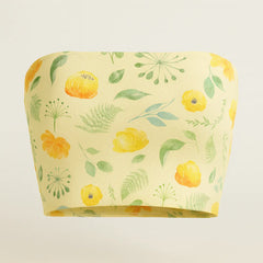 Yellow bandeau top with floral pattern on a light gray background