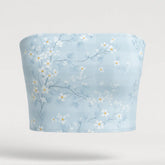 Floral-patterned tube top on a light gray background