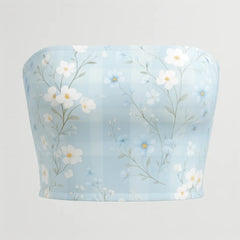 Light blue bandeau top with floral pattern on a light gray background