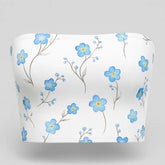 White strapless top with blue floral pattern on a white background