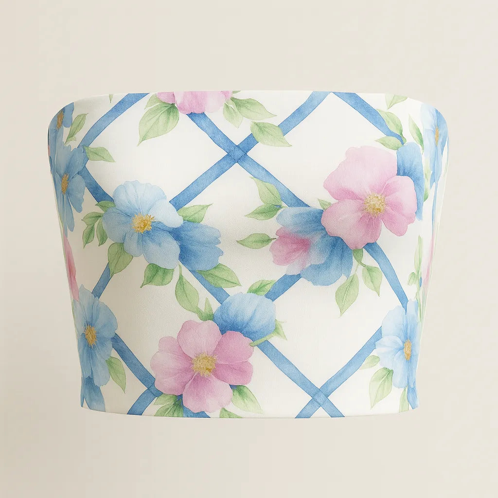 Floral-patterned fabric with blue and pink flowers on a white background