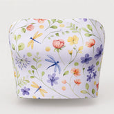 Floral and dragonfly patterned tube top on a white background