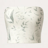 White tube top with green leaf pattern on a white background