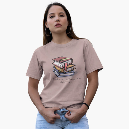 Woman wearing a beige t-shirt with a graphic design on a white background