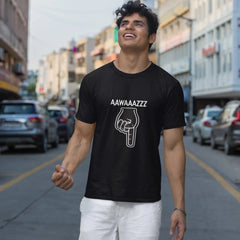 Man wearing a black t-shirt with text and graphic on a city street