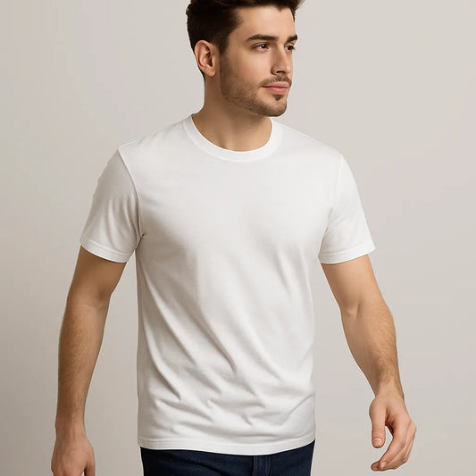 Man wearing a plain white t-shirt against a neutral background