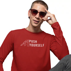 Person wearing a red shirt with 'Push Yourself' text and graphic, posing with sunglasses.