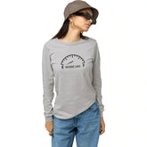 Woman wearing a gray long-sleeve shirt with a graphic design on a white background