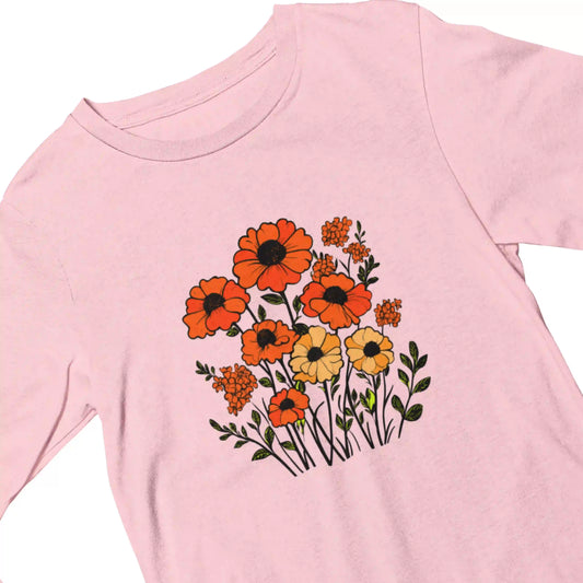 Pink t-shirt with orange and yellow floral design on a white background