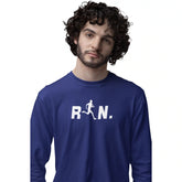 Man wearing a blue long-sleeve shirt with 'R N.' printed on it against a white background