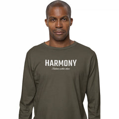 Man wearing a green long-sleeve shirt with 'HARMONY' printed on it against a white background