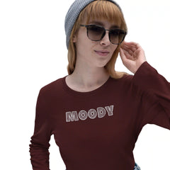 Person wearing a maroon sweatshirt with 'MOODY' text, gray beanie, and sunglasses on a white background