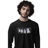 Person wearing a black long-sleeve shirt with ghost design on a white background