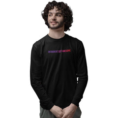 Man wearing a black long-sleeve shirt with 'Introvert But Awesome' text on a white background