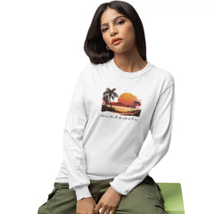 Woman wearing a white sweatshirt with a tropical design on a white background