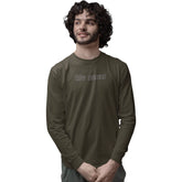 Man wearing a green long-sleeve shirt with text on a white background