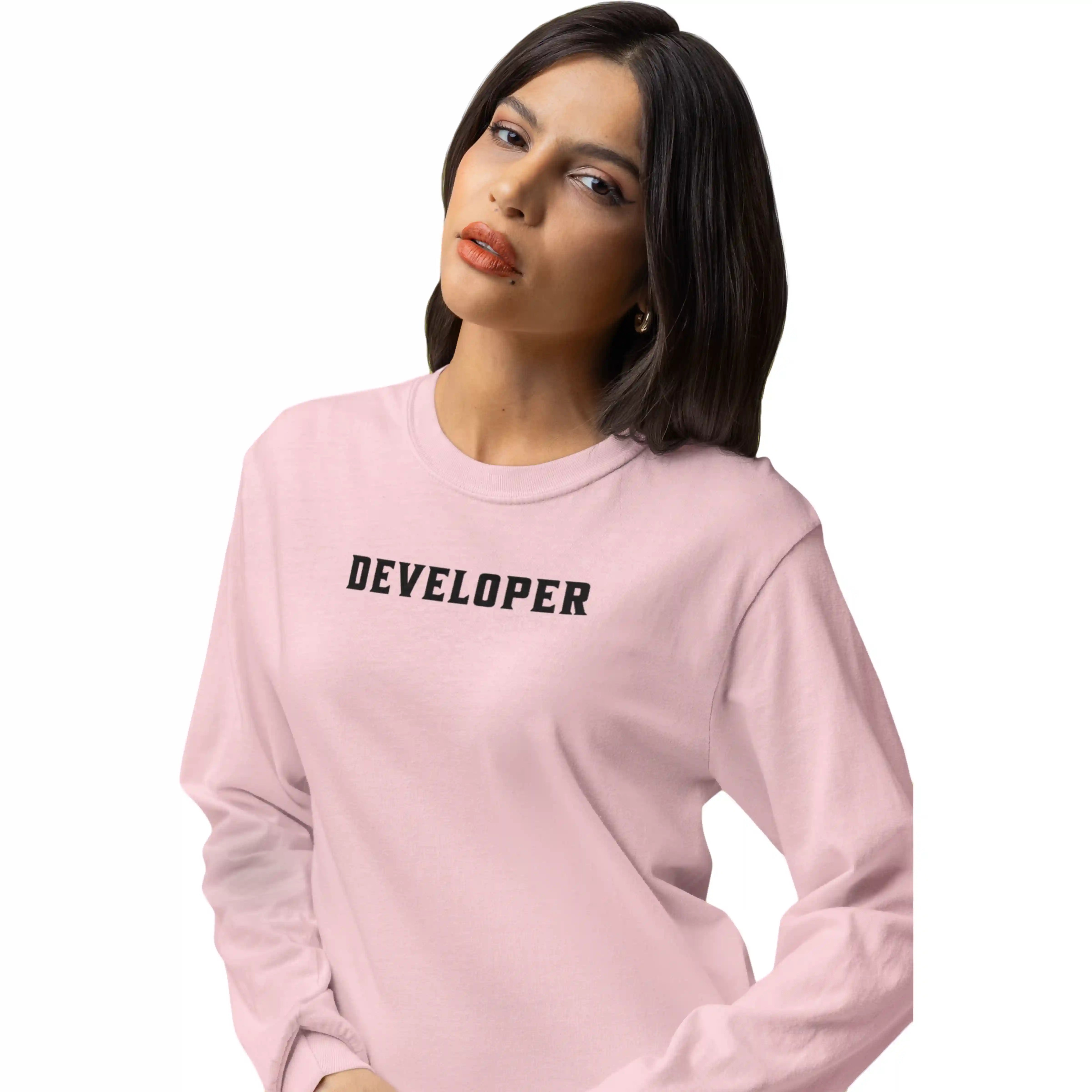 Person wearing a pink sweatshirt with 'DEVELOPER' text on a white background