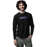 Man wearing a black long-sleeve shirt with 'GAME' printed on it against a white background