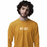 Man wearing a mustard yellow long-sleeve shirt with 'STAY SOCIAL' text on a white background