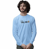 Man wearing a light blue long-sleeve shirt with text on a white background