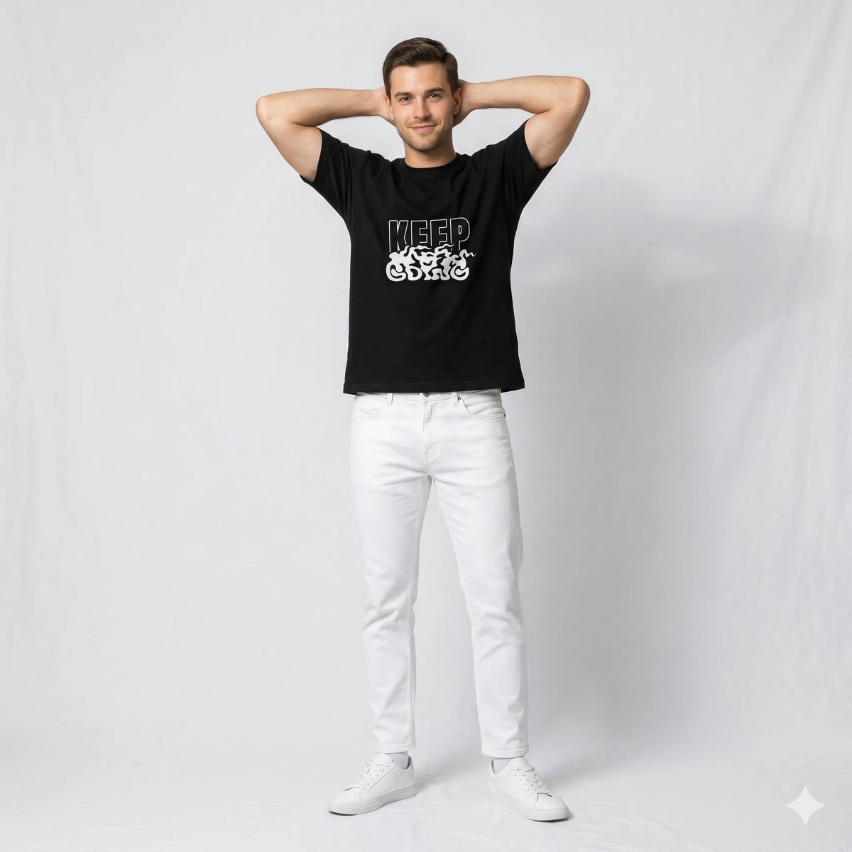 Man wearing a black t-shirt with white text and graphics against a plain background