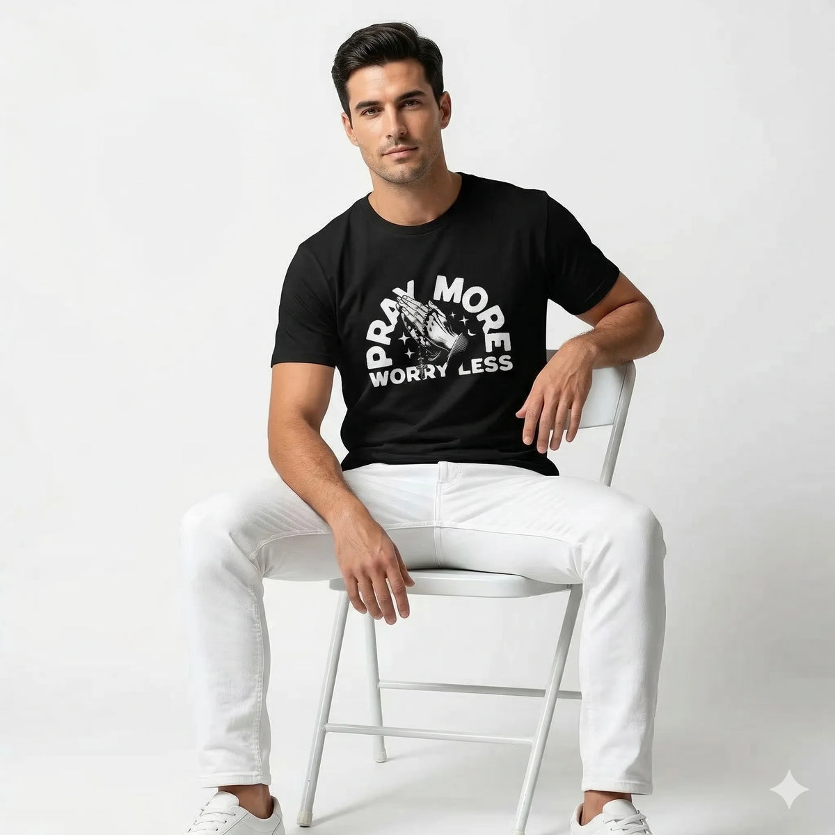Black t-shirt with 'Pray More Worry Less' text and graphic on a gray background