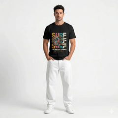 Black t-shirt with colorful 'Surf The Endless Summer' design on a hanger against a white wall.