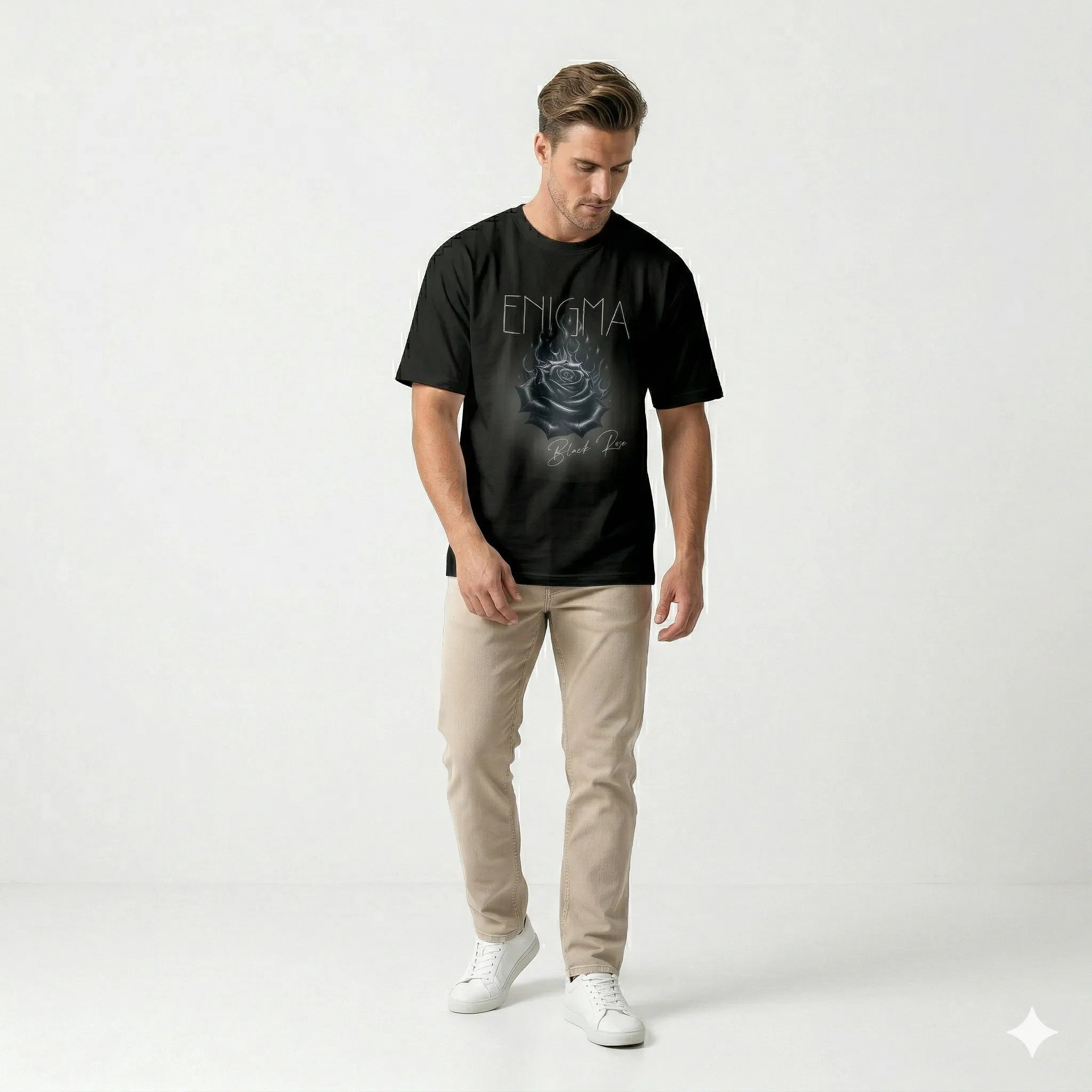 Man wearing a black t-shirt with 'Enigma' design on a white background