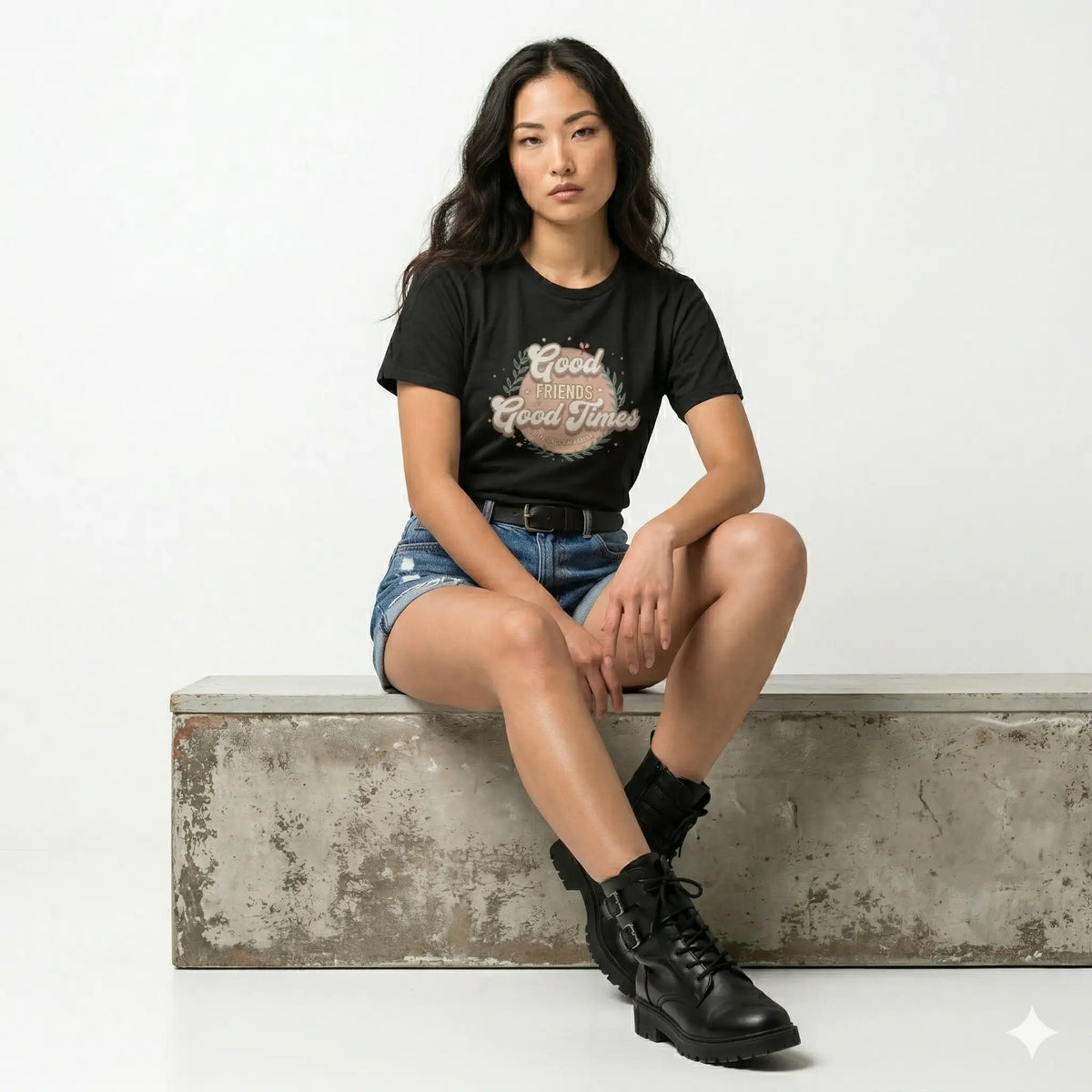 Person wearing a black sweatshirt with 'Good Friends Good Times Forever' text