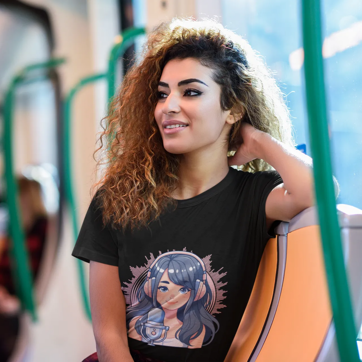 Woman wearing a black t-shirt with a graphic design on a bus