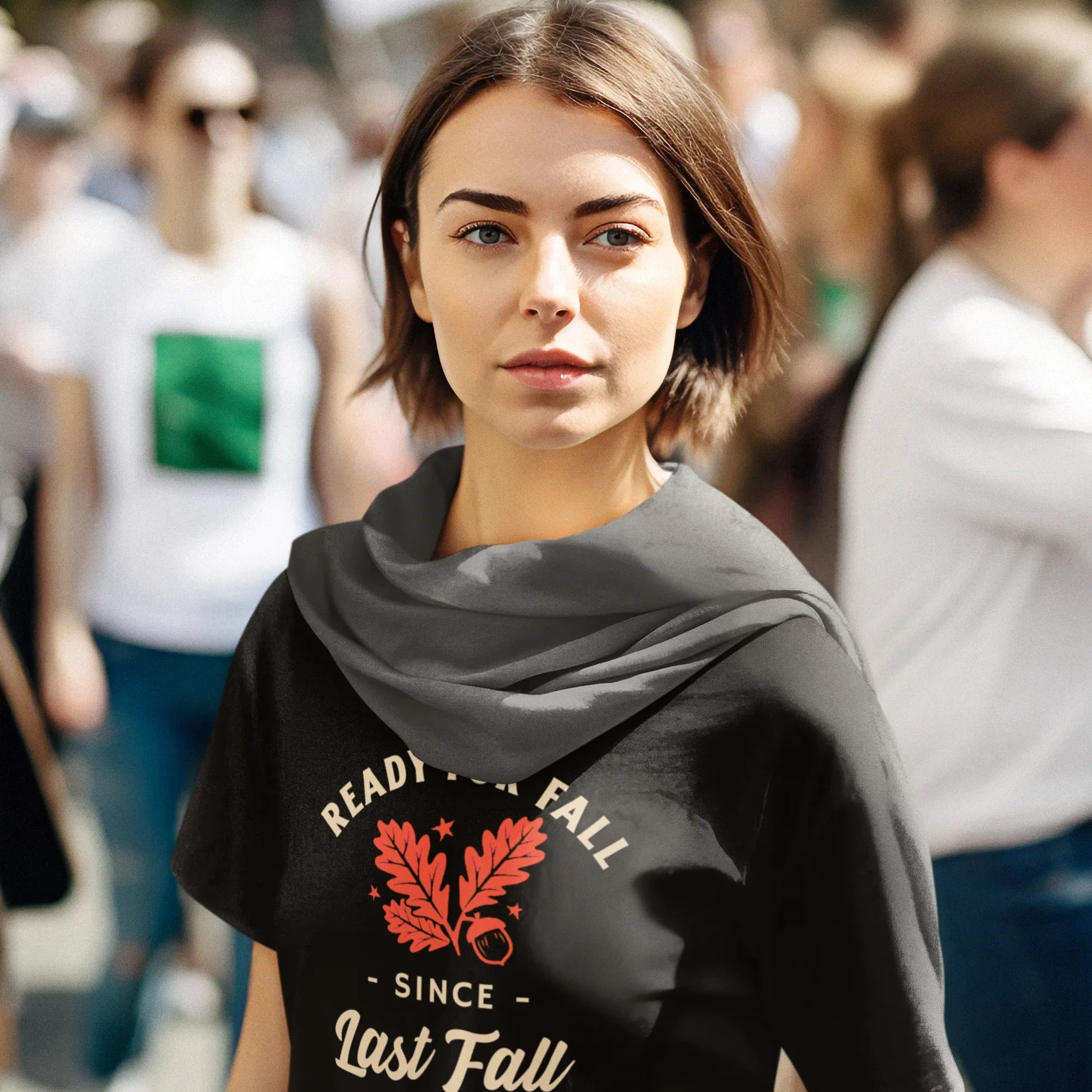 Woman wearing a black t-shirt with a graphic design in an outdoor setting