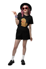 Person wearing a black t-shirt with a dog graphic and black shorts on a white background
