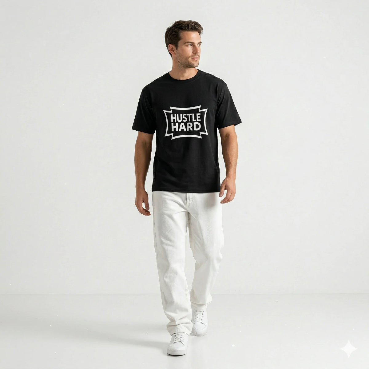 Man wearing a black t-shirt with 'Hustle Hard' text on a white background