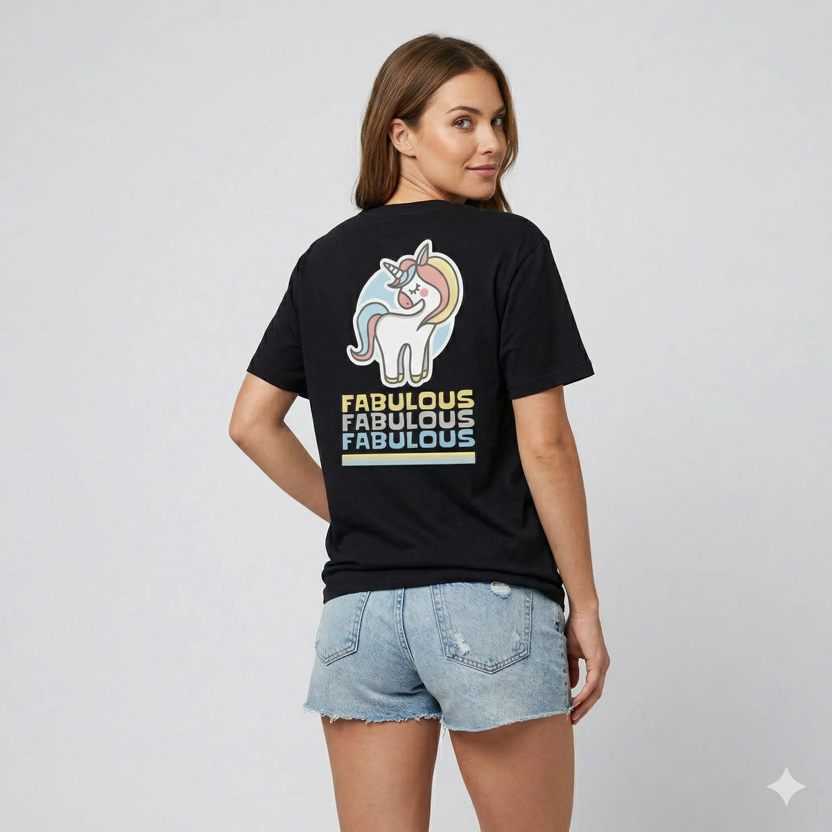 Woman wearing a black t-shirt with a unicorn graphic and 'fabulous' text on the back.