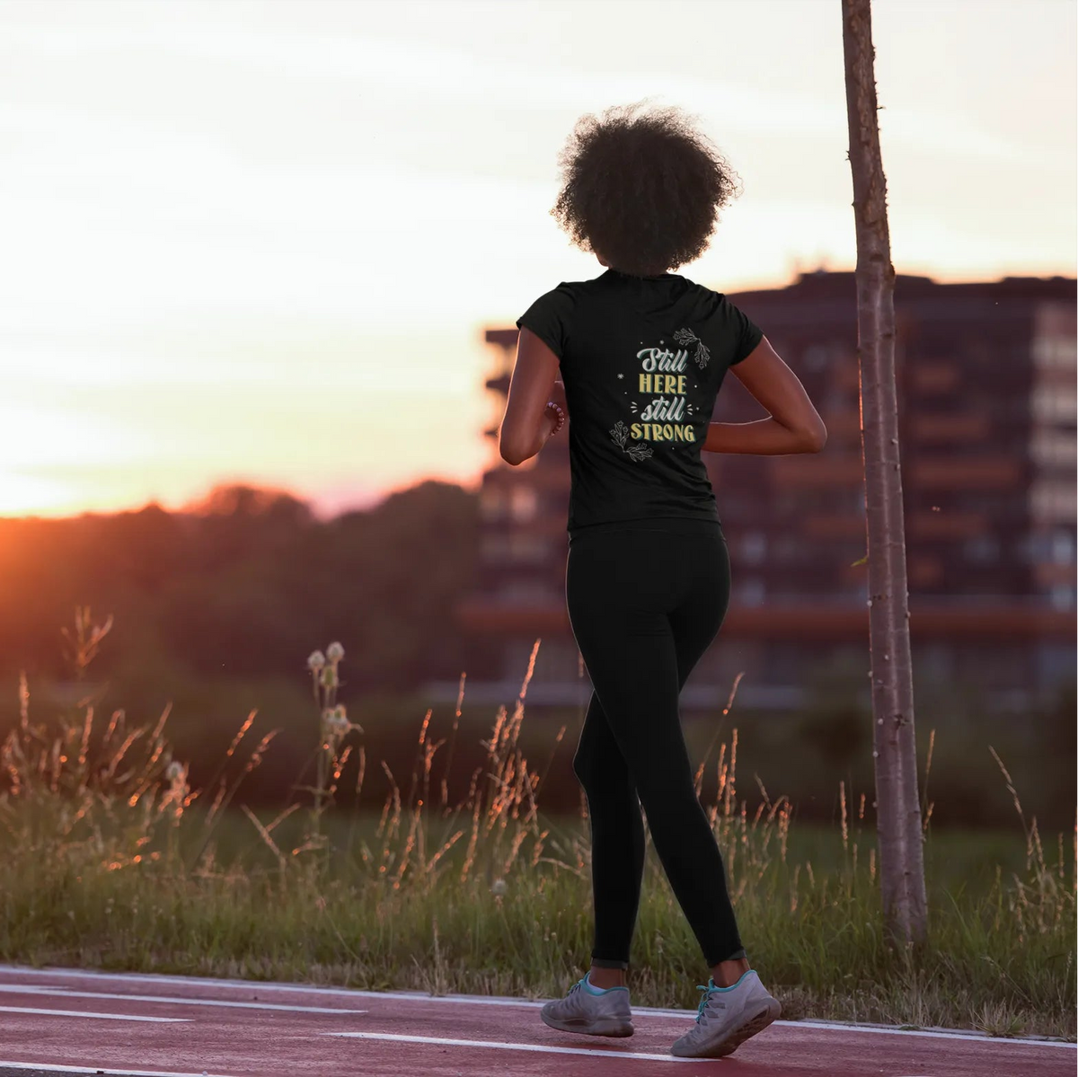 Person running on a path with a sunset in the background