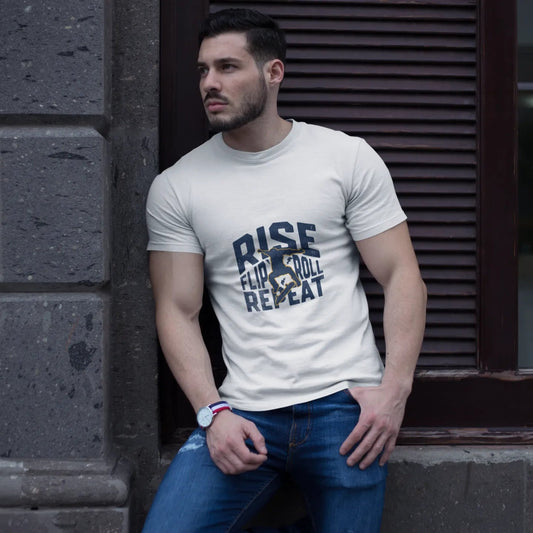 Man wearing a white t-shirt with text standing against a textured wall.