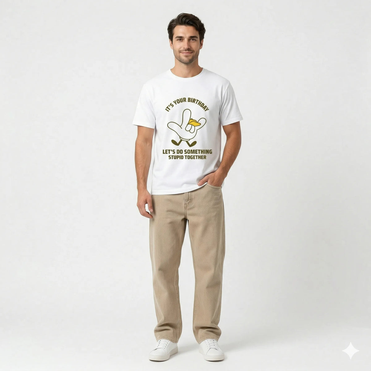 Person wearing a white t-shirt with a graphic design and text, standing against a bamboo wall.