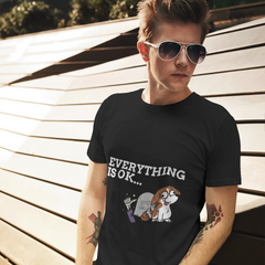 Person wearing a black t-shirt with a graphic and text, standing outdoors.