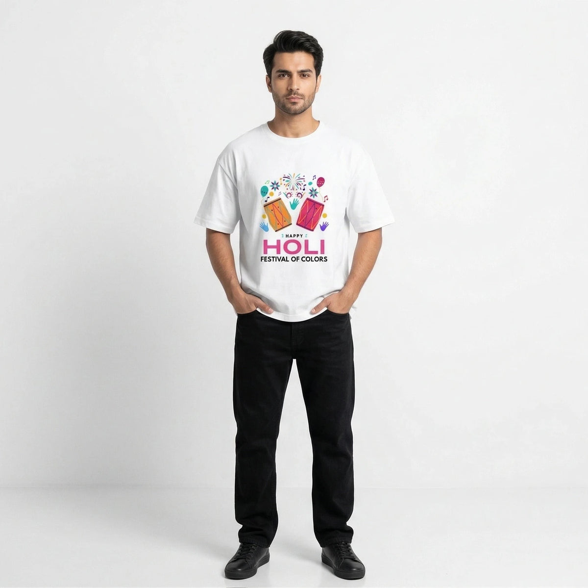 Man wearing a white t-shirt with colorful graphics and text on a white background